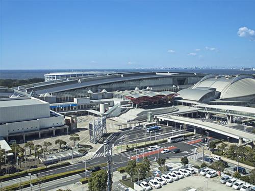 an airport with cars parked in a parking lot at JR East Hotel Mets Premier Makuhari Toyosuna in Chiba