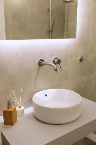 a white sink sitting on a counter in a bathroom at Anastasia Kimolos in Kimolos