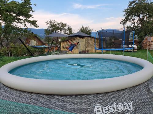 a large pool of water in a yard at Lavanda cottage in Verkhovyna