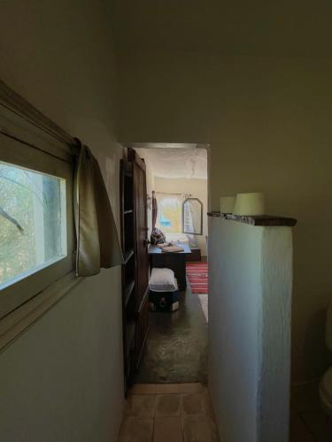 a hallway of a room with a refrigerator at Riad Sahara Sunset Beach Douira in Agadir