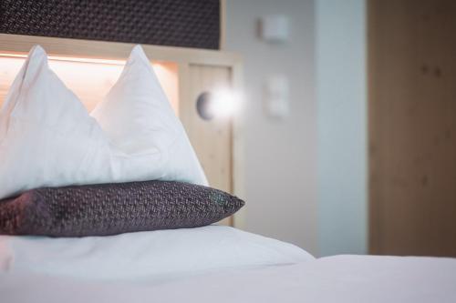 Una cama o camas en una habitación de Terentnerhof 4*S active & lifestyle hotel