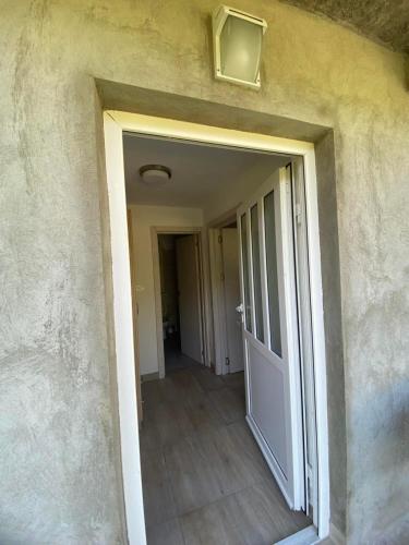 an empty hallway with a door in a building at Holiday home Seoska idila in Šavnik