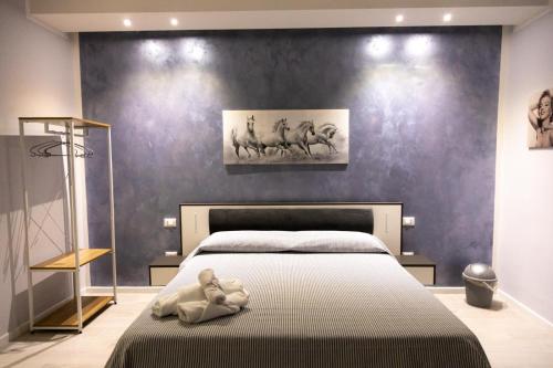 Postel nebo postele na pokoji v ubytování Pietre Azzurre Rooms