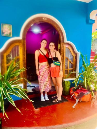 two girls are standing in a toy house at Hema Holiday Villa in Trincomalee