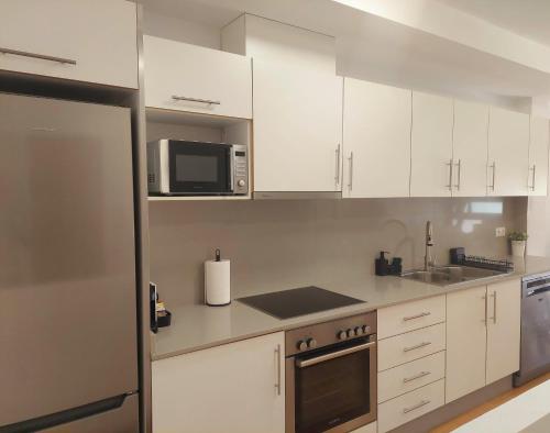 Η κουζίνα ή μικρή κουζίνα στο Cozy apartment near the beach