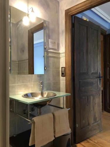 a bathroom with a sink and a mirror at CASA RURAL HORMILLA in Hormilla