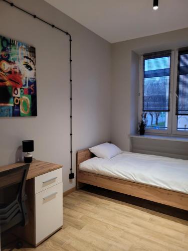 Ένα ή περισσότερα κρεβάτια σε δωμάτιο στο Axo-Hostel 5
