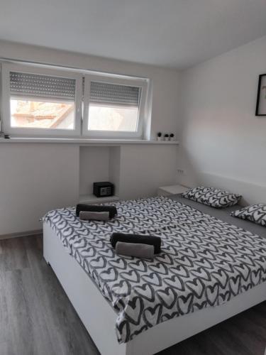 Postel nebo postele na pokoji v ubytování Apartmaja Eva&Pia