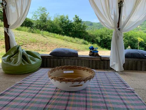 a basket sitting on a blanket next to a window at Nina in Arandjelovac