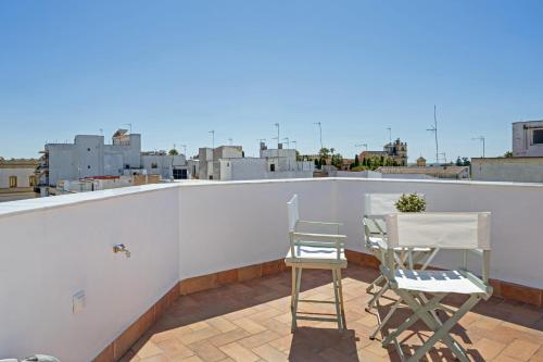 two chairs and a table on a roof at Casa Milano 3 in Jerez de la Frontera