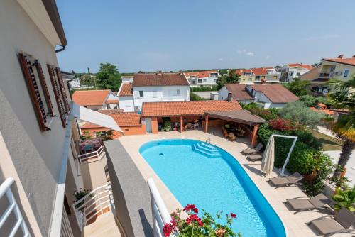 an overhead view of a swimming pool in a building at Apartment Complex Irena with Pool in Poreč