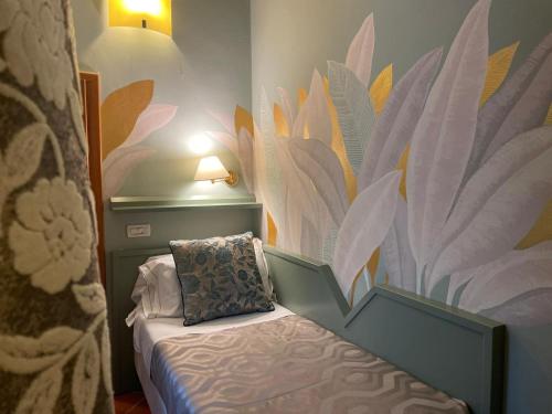 Postel nebo postele na pokoji v ubytování Hotel Maxim Axial
