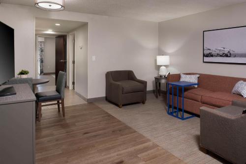 a living room with a couch and a table at Hampton Inn Northwood in Myrtle Beach