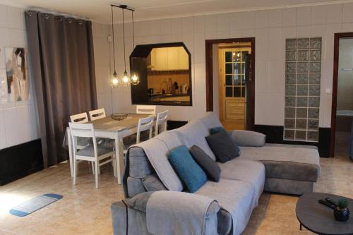a living room with a couch and a table at House 37North in Mosteiros