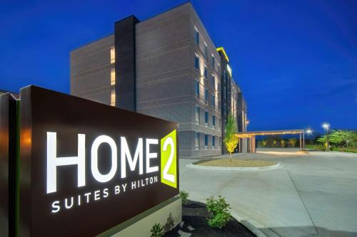 a home suites by autism sign in front of a building at Home2 Suites By Hilton West Chester Cincinnati in West Chester