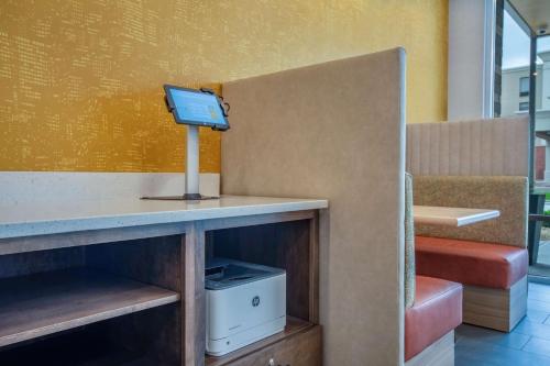 a room with a desk with a tv on it at Home2 Suites By Hilton West Chester Cincinnati in West Chester