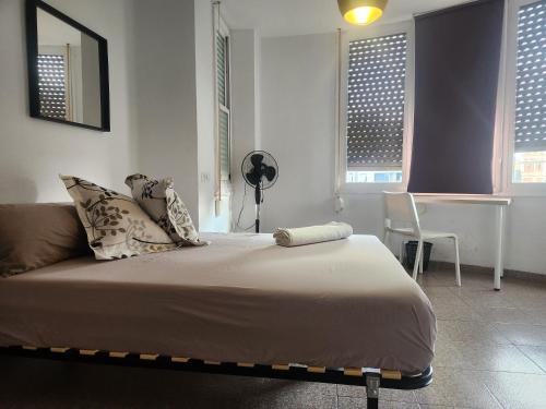 Posteľ alebo postele v izbe v ubytovaní eXperience Rooms Valencia