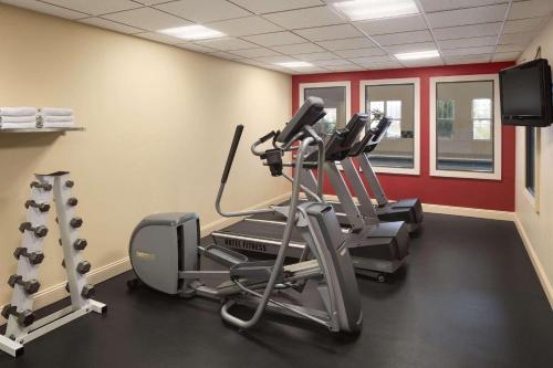 a gym with two tread machines and a treadmill at Country Inn & Suites by Radisson, Gettysburg, PA in Gettysburg