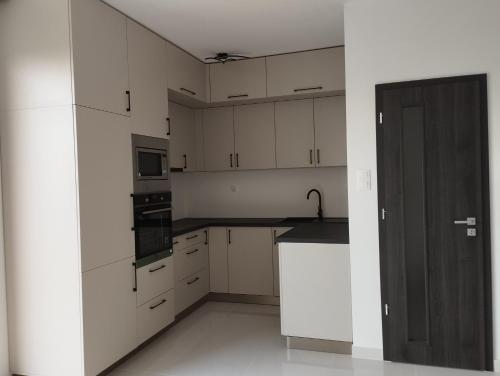Kuchyňa alebo kuchynka v ubytovaní Híd Köz Penthouses Apartman