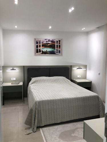 Postel nebo postele na pokoji v ubytování Heart of Mitrovica