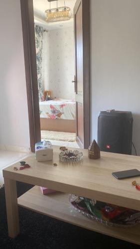 a table with a mirror in a room at شالية بورتو جولف مارينا الساحل الشمالى in Abû Zeira