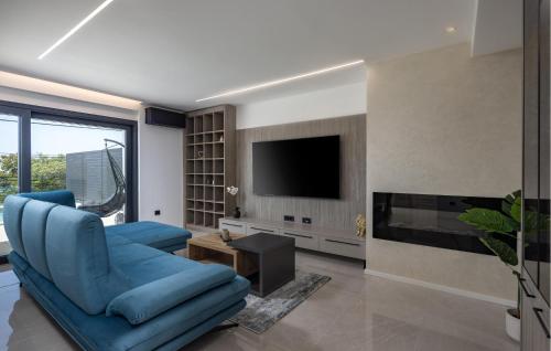 Televiisor ja/või meelelahutuskeskus majutusasutuses Gorgeous Home In Kostrena