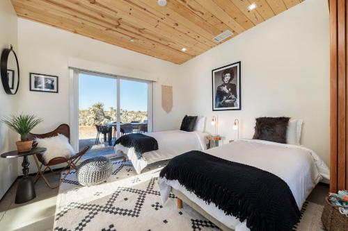 Ένα ή περισσότερα κρεβάτια σε δωμάτιο στο The Gaslight By The Cohost Company