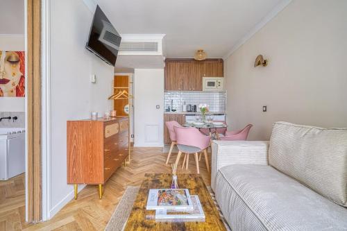 a living room with a couch and a table at Inn Place to be Paris La Defense in Courbevoie