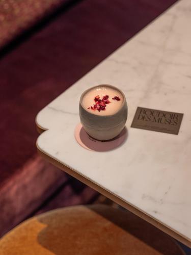 a small dessert sitting on top of a table at Boudoir des Muses in Paris