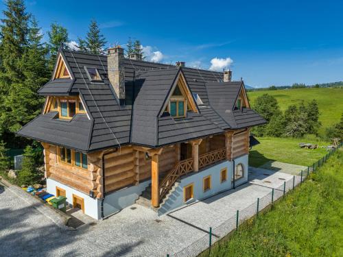 an overhead view of a log home with a black roof at Chaty pod Giewontem in Zakopane