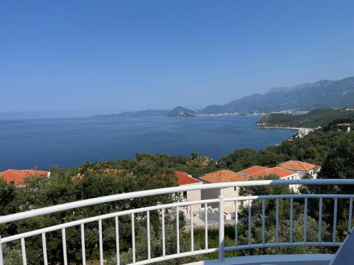 a balcony with a view of the water at Vila Natalia in Petrovac na Moru