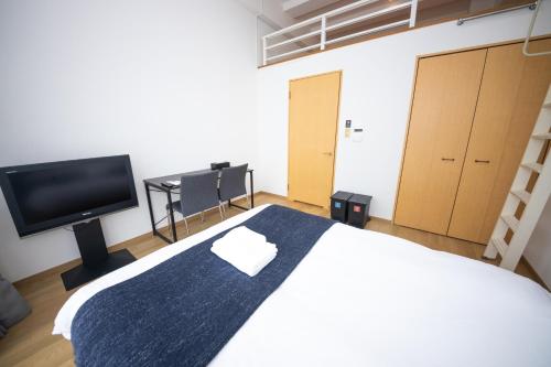 Giường trong phòng chung tại goom Hotel Nakasu Maxim