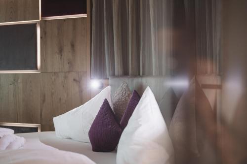 Una cama o camas en una habitación de Terentnerhof 4*S active & lifestyle hotel