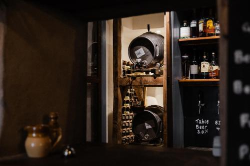 a wine cellar with a bunch of bottles of wine at The Bulls Head Wild Cabins in Hereford