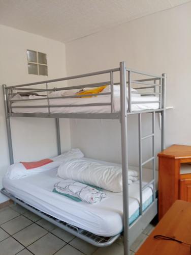 Ένα ή περισσότερα κρεβάτια σε δωμάτιο στο n4 studio 5 personnes candedo