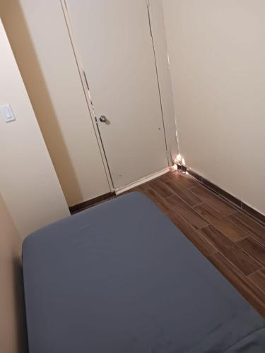 a refrigerator in the corner of a room at Zen Home in Santa Ana