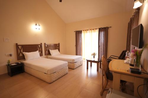 Postel nebo postele na pokoji v ubytování Indismart Woodbourne Resort