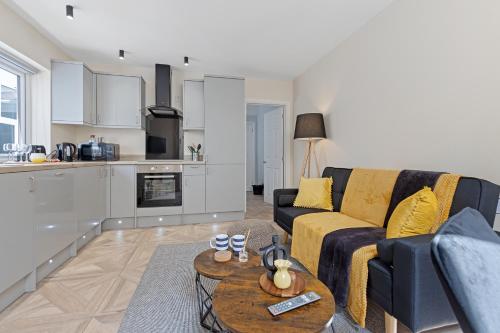 a living room with a couch and a table at Modern Apartment Free Off Road Parking 2x Double Rooms Suite 11 in Nottingham