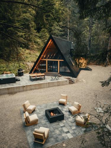 an overhead view of a cabin with chairs and a fireplace at The Cozy Chalet in Bosanski Petrovac