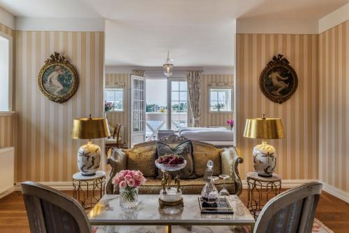 a living room with a couch and a table at Dyvig Badehotel in Nordborg