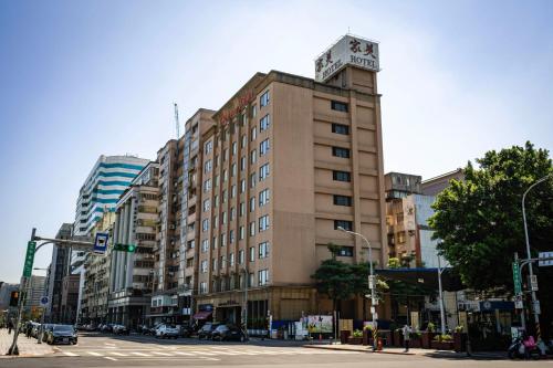 a tall building with a clock on top of it at 家美瑞品 台北 - Jiamei Hotel in Taipei