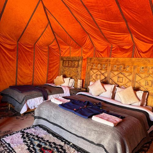 Ένα ή περισσότερα κρεβάτια σε δωμάτιο στο Super Luxury camp