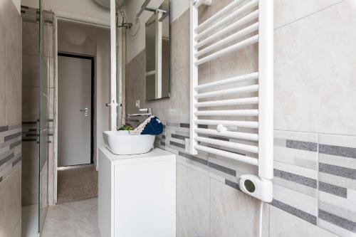 a bathroom with a sink and a toilet at Bilocale Noverasco IEO 3 in Opera