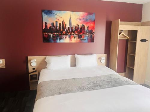 a bedroom with a white bed with a painting on the wall at Hotel Wood Inn Bordeaux Aéroport in Mérignac