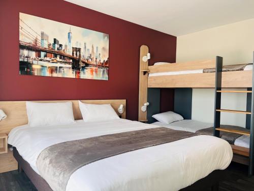 a bedroom with two bunk beds and a ladder at Hotel Wood Inn Bordeaux Aéroport in Mérignac