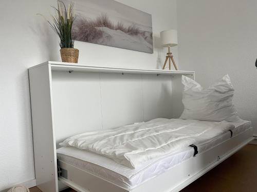 Postel nebo postele na pokoji v ubytování Küstenbude Strandbude