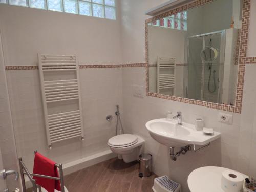 a bathroom with a toilet and a sink at Red Flat In Rome in Rome