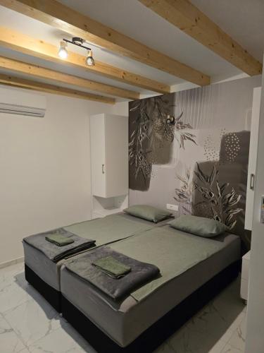a bedroom with a large bed in a room at Apartment Rose Cres 4 in Cres