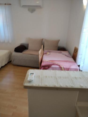 Postel nebo postele na pokoji v ubytování Apartments Nevija