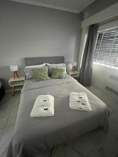 Ένα ή περισσότερα κρεβάτια σε δωμάτιο στο Buenos Aires Downtown Experience